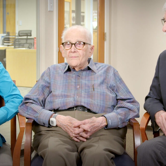 Walter Levy, Julie & Ken Robinowitz are seated in a studio setting telling the story of establishing their fund.